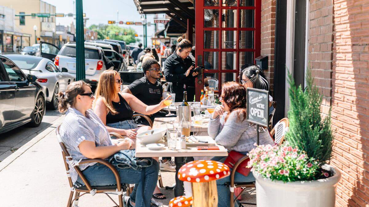 Diners sit on the patio at Main Street Bistro in Grapevine. The city has one of the most charming Main Streets in America, according to USA Today.